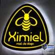 Puede ser una imagen de texto que dice "Ximiel miel de abeja DESIGN CENTER 3122-1929 470-7676 676"